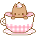 a white and pink cup with a cat inside. the cat has some cream on its head